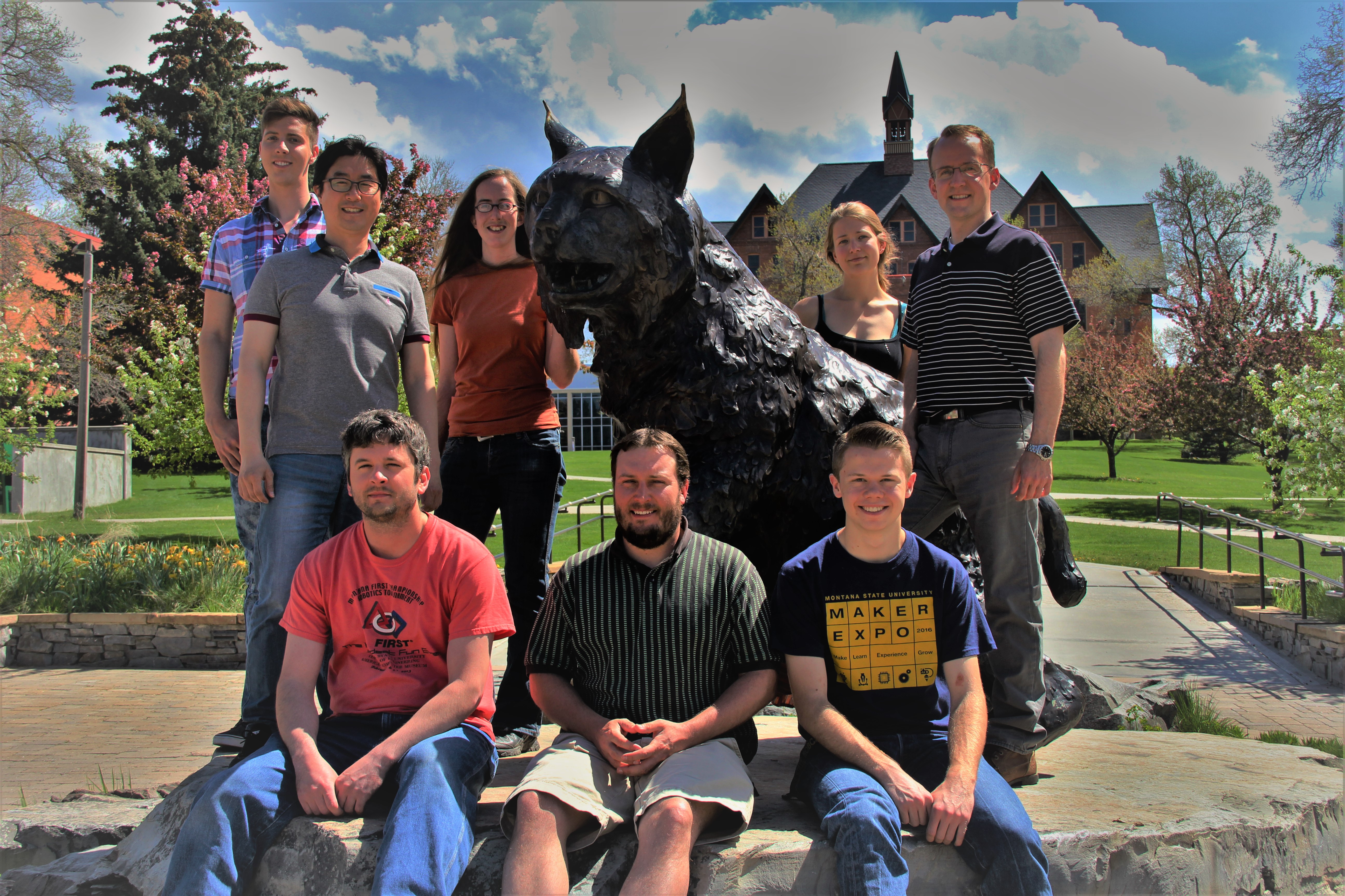 Carlson Lab Members Members of the Biochemical Engineering Lab standing around Spirit the bobcat.
